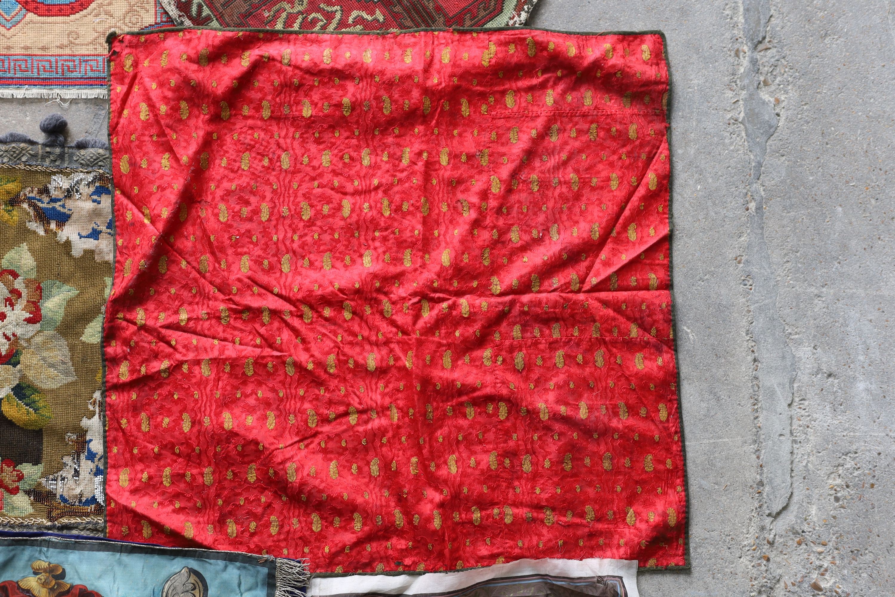 An Ottoman silk Koran cloth, three needle and bead work covers and assorted textiles